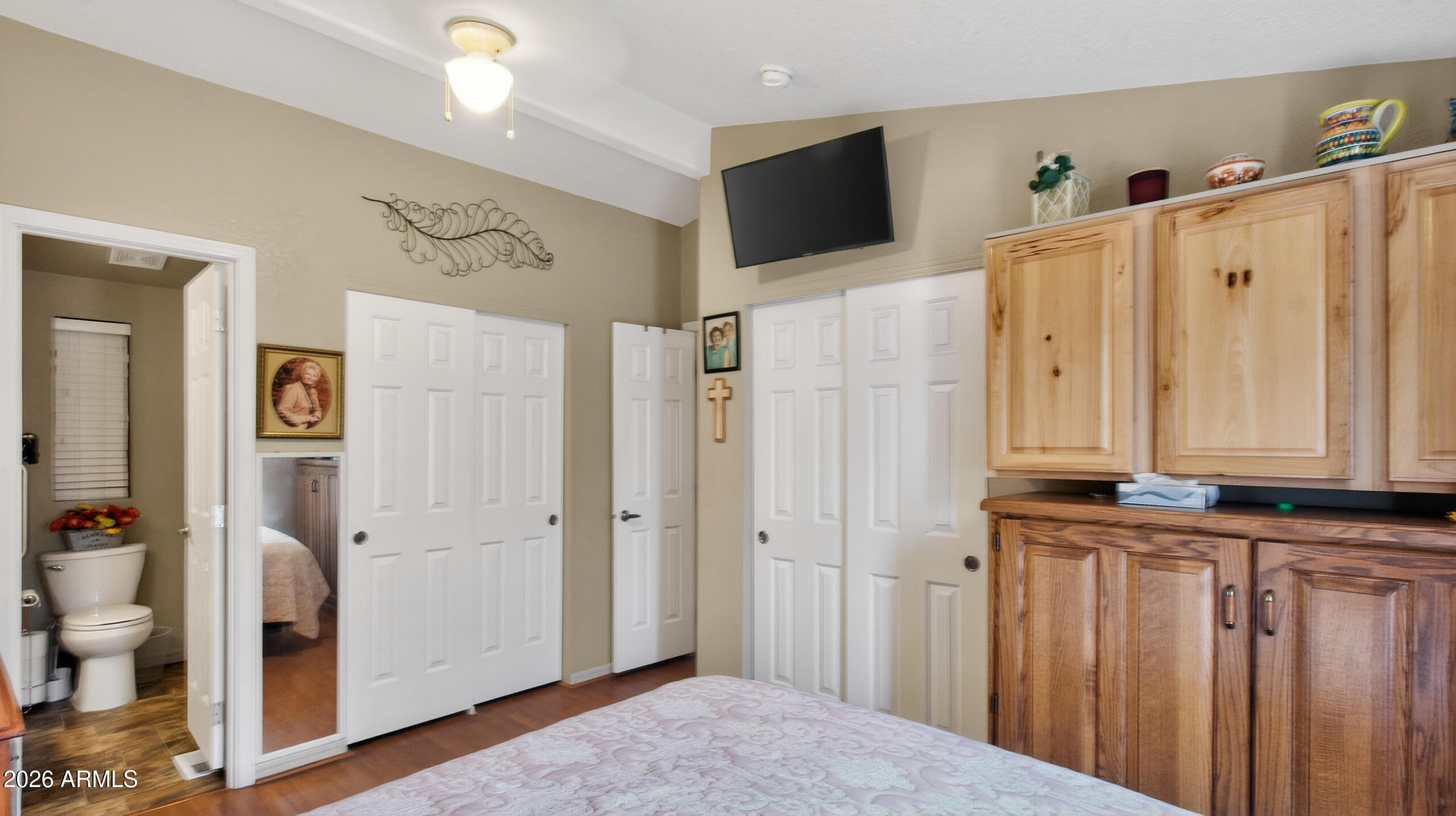 5735 East McDowell Road, Unit 408 Mesa, AZ 85215 - Photo 14 of 42 a view of a livingroom with wooden floor and bathroom view