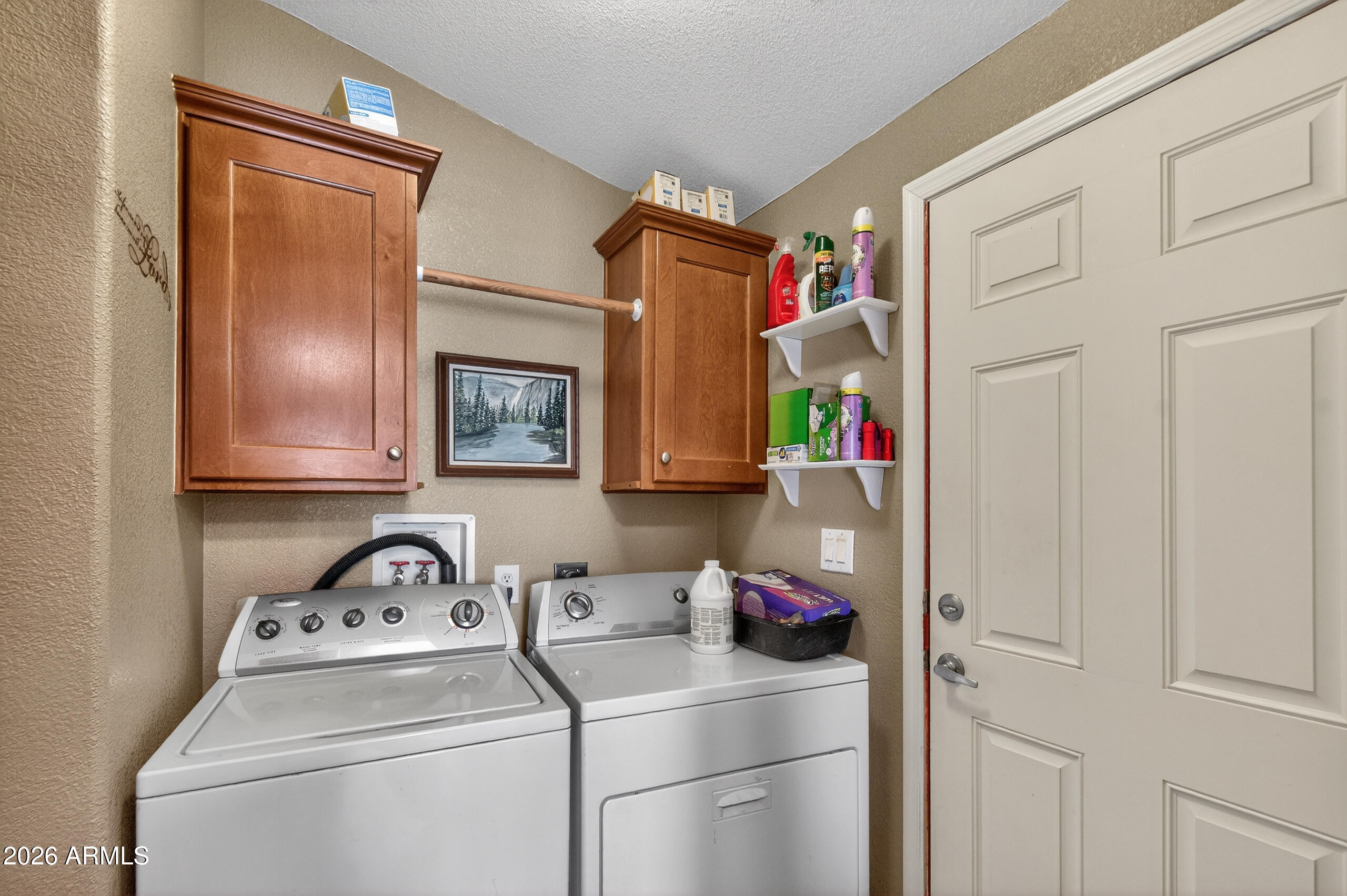 5735 East McDowell Road, Unit 408 Mesa, AZ 85215 - Photo 18 of 42 a storage room with washer and dryer
