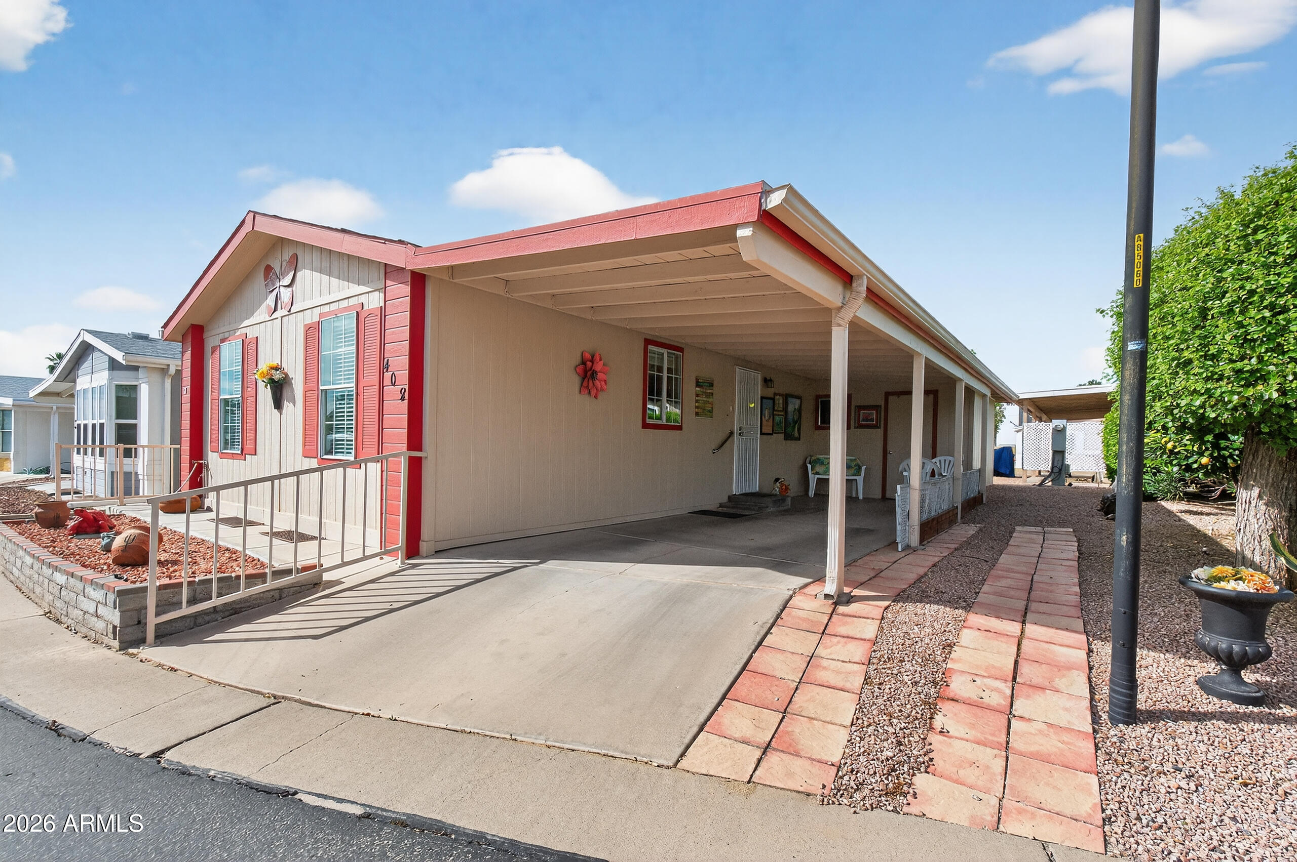 5735 East McDowell Road, Unit 408 Mesa, AZ 85215 - Photo 2 of 42 a view of house with street
