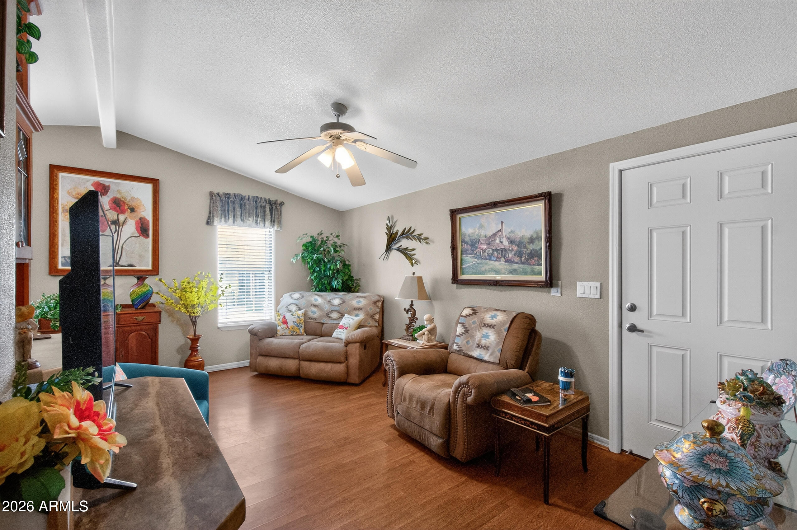 5735 East McDowell Road, Unit 408 Mesa, AZ 85215 - Photo 4 of 42 a living room with furniture