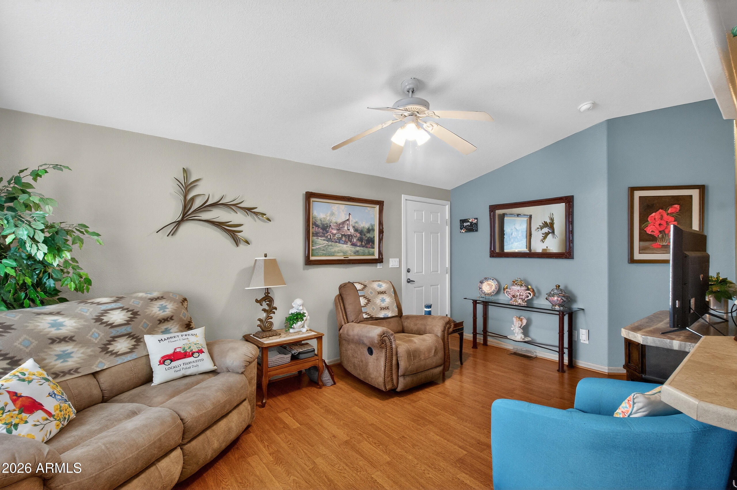 5735 East McDowell Road, Unit 408 Mesa, AZ 85215 - Photo 5 of 42 a living room with furniture
