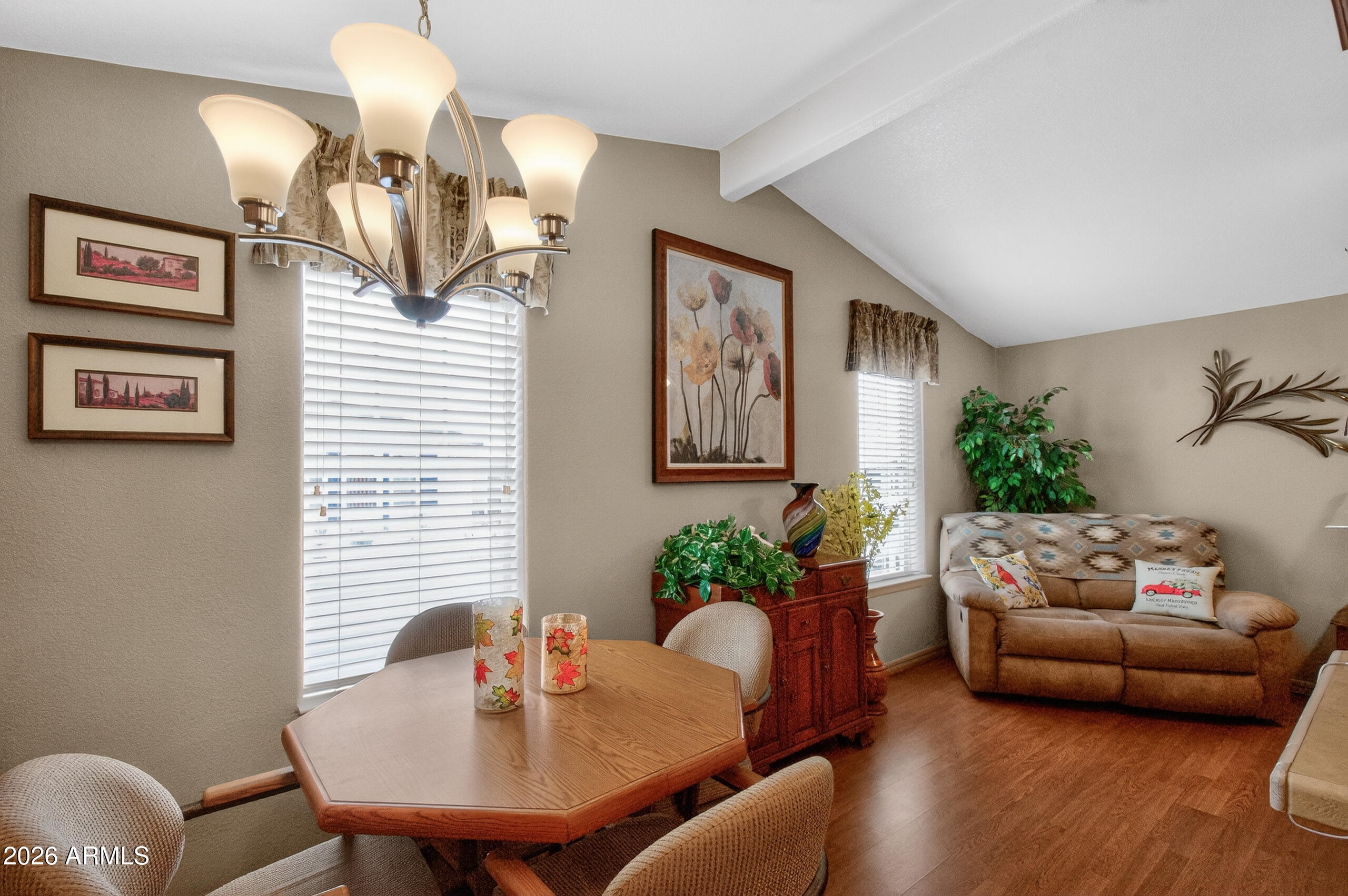 5735 East McDowell Road, Unit 408 Mesa, AZ 85215 - Photo 8 of 42 a living room with furniture and a potted plant