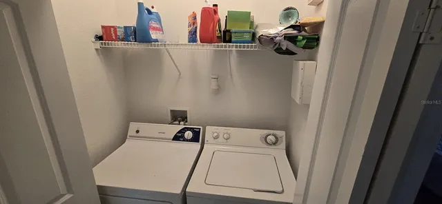 a utility room with dryer and washer