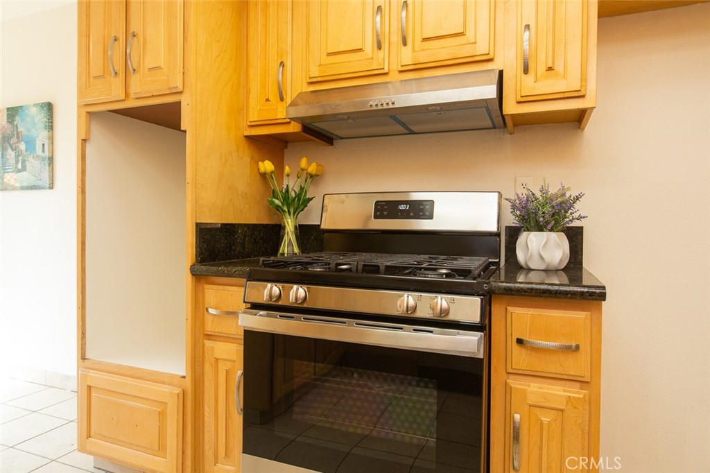 3790 Nut Tree Lane Riverside, CA 92501 - Photo 11 of 31 a stove top oven sitting inside of a kitchen