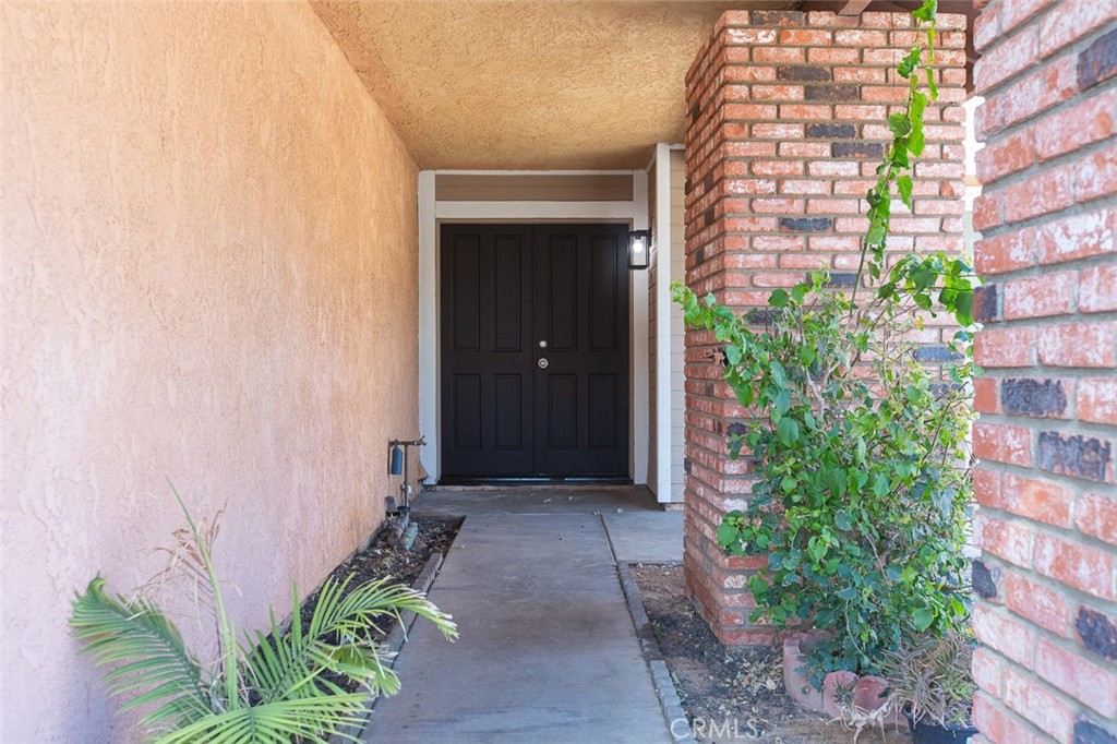 3790 Nut Tree Lane Riverside, CA 92501 - Photo 2 of 31 front view of a brick house with a large window and plants