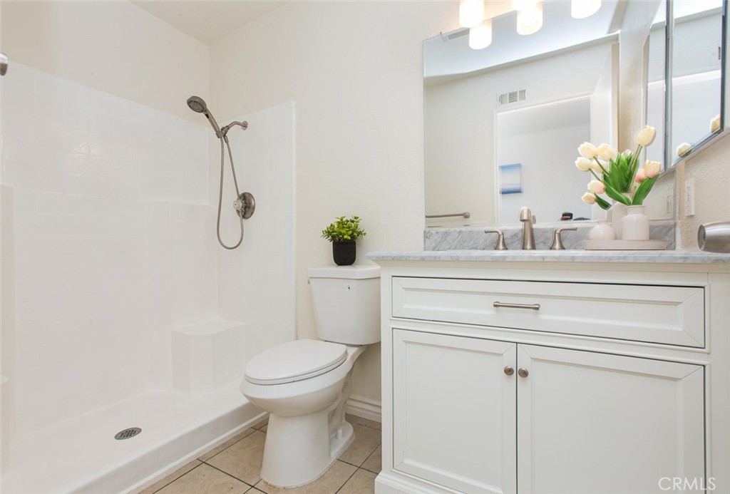 3790 Nut Tree Lane Riverside, CA 92501 - Photo 24 of 31 a bathroom with a sink a toilet and a mirror
