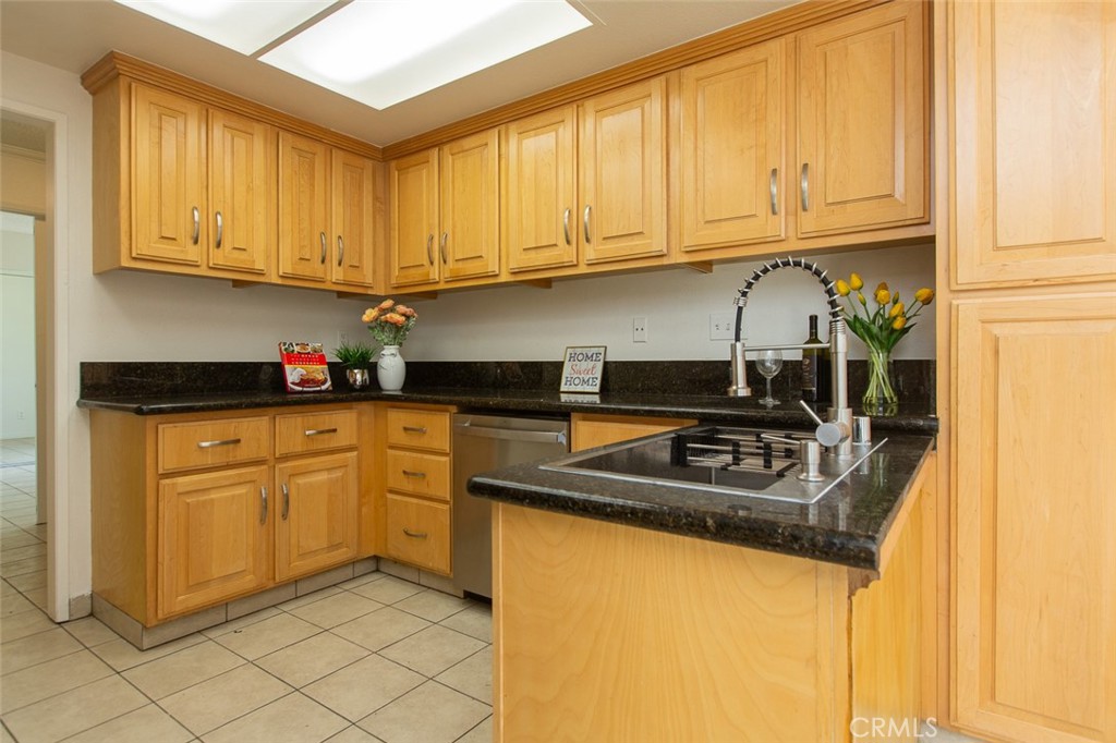 3790 Nut Tree Lane Riverside, CA 92501 - Photo 10 of 31 a kitchen with stainless steel appliances granite countertop a sink stove and cabinets