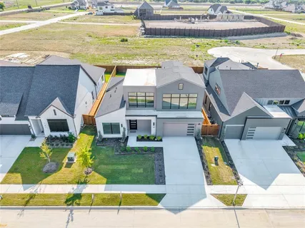 an aerial view of a house with swimming pool