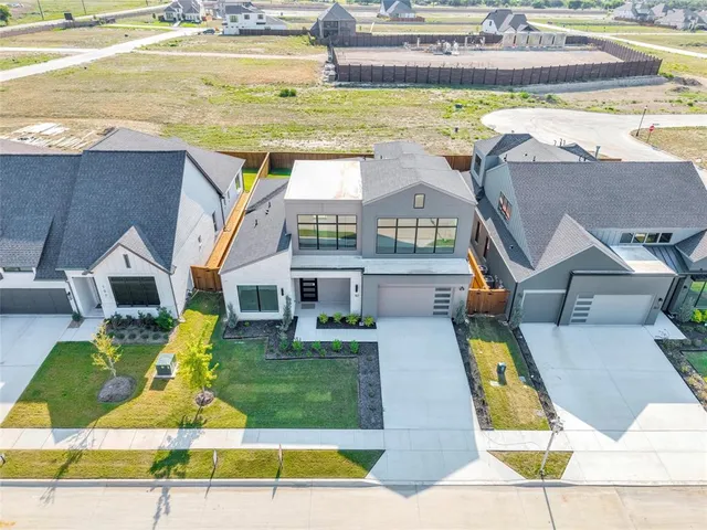 an aerial view of a house with swimming pool