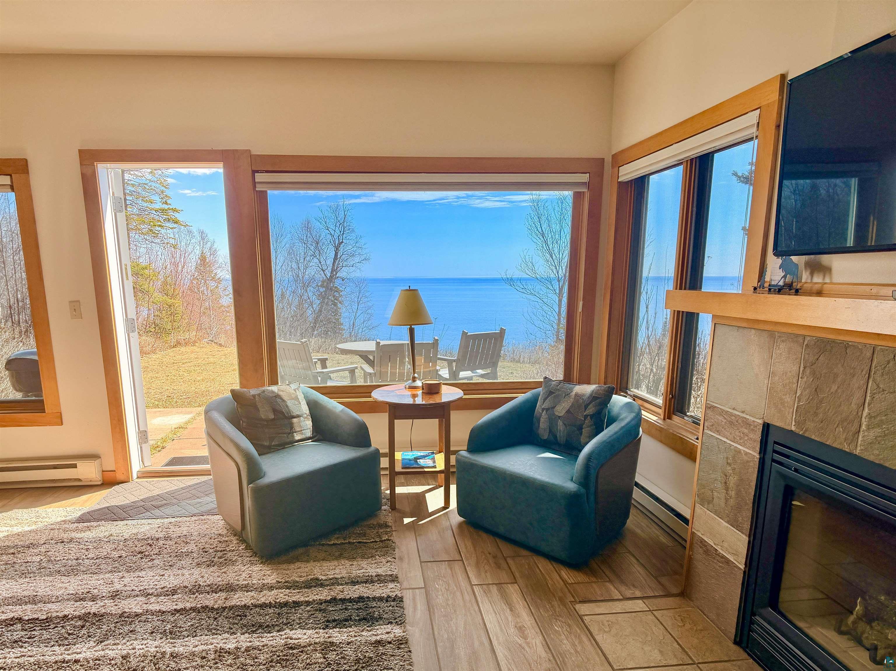 504-506 Poplar River Road, Unit 505 Lutsen, MN 55612 - Photo 31 of 39 Expansive window framing a body of water, featuring natural wood trim