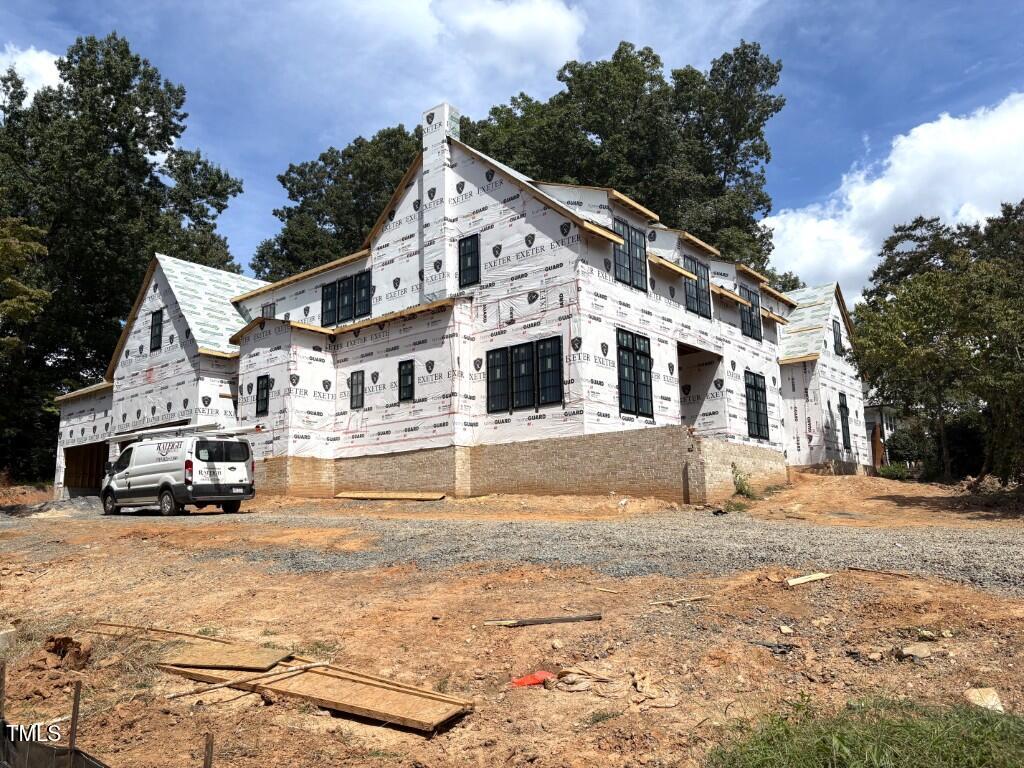 3358 Hampton Road Raleigh, NC 27607 - Photo 4 of 27 a view of a white house with a yard covered in snow