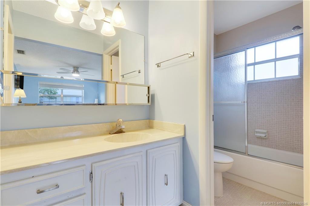 211 Manatee Lane, Unit D Fort Pierce, FL 34982 - Photo 20 of 25 a bathroom with a sink and a mirror