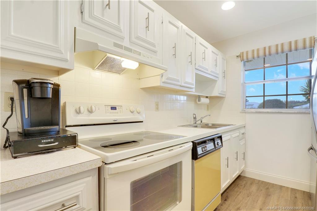 211 Manatee Lane, Unit D Fort Pierce, FL 34982 - Photo 10 of 25 a utility room with dryer and washer
