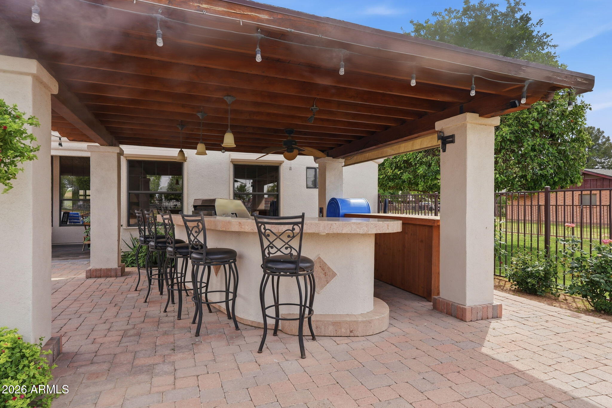 332 East Harrison Street Gilbert, AZ 85295 - Photo 22 of 101 a view of a patio with table and chairs a barbeque with wooden floor and roof with potted plants