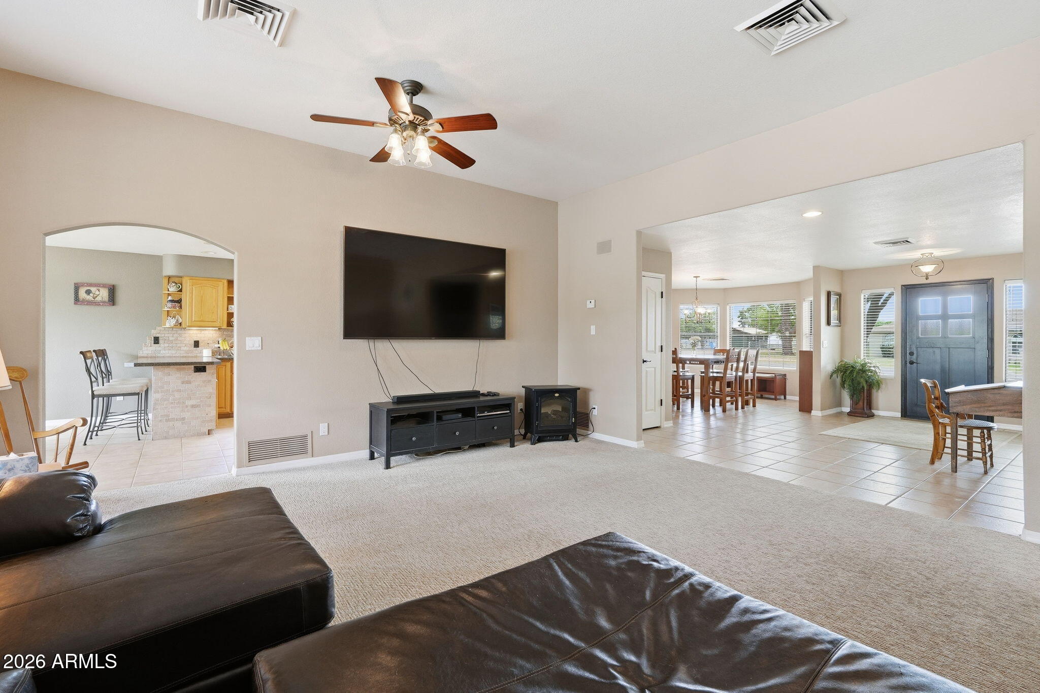 332 East Harrison Street Gilbert, AZ 85295 - Photo 26 of 101 a living room with furniture and a flat screen tv