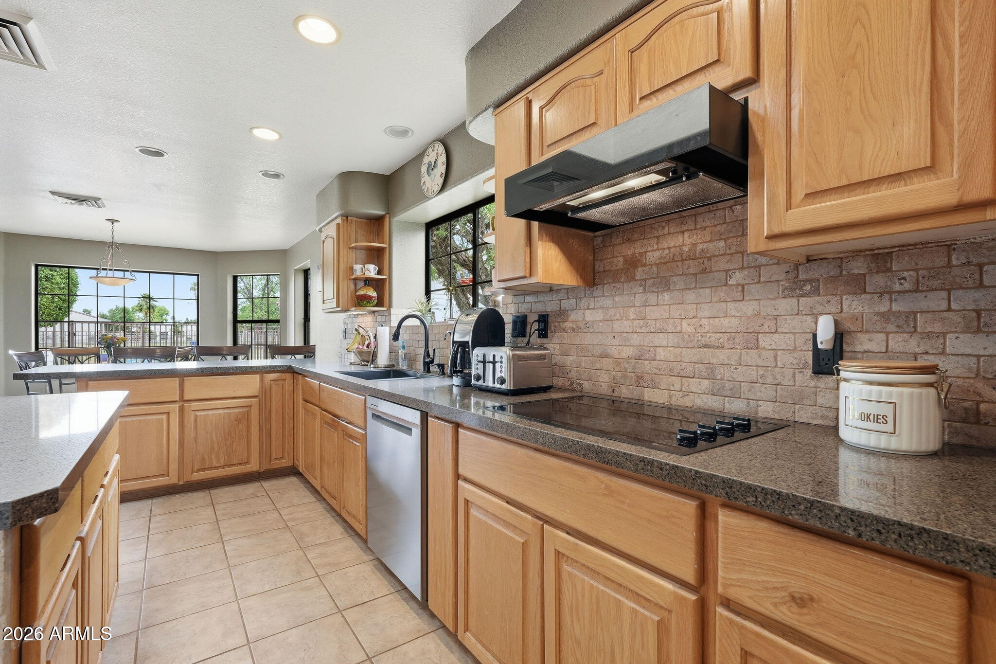 332 East Harrison Street Gilbert, AZ 85295 - Photo 28 of 101 a kitchen with stainless steel appliances granite countertop a sink a stove and cabinets