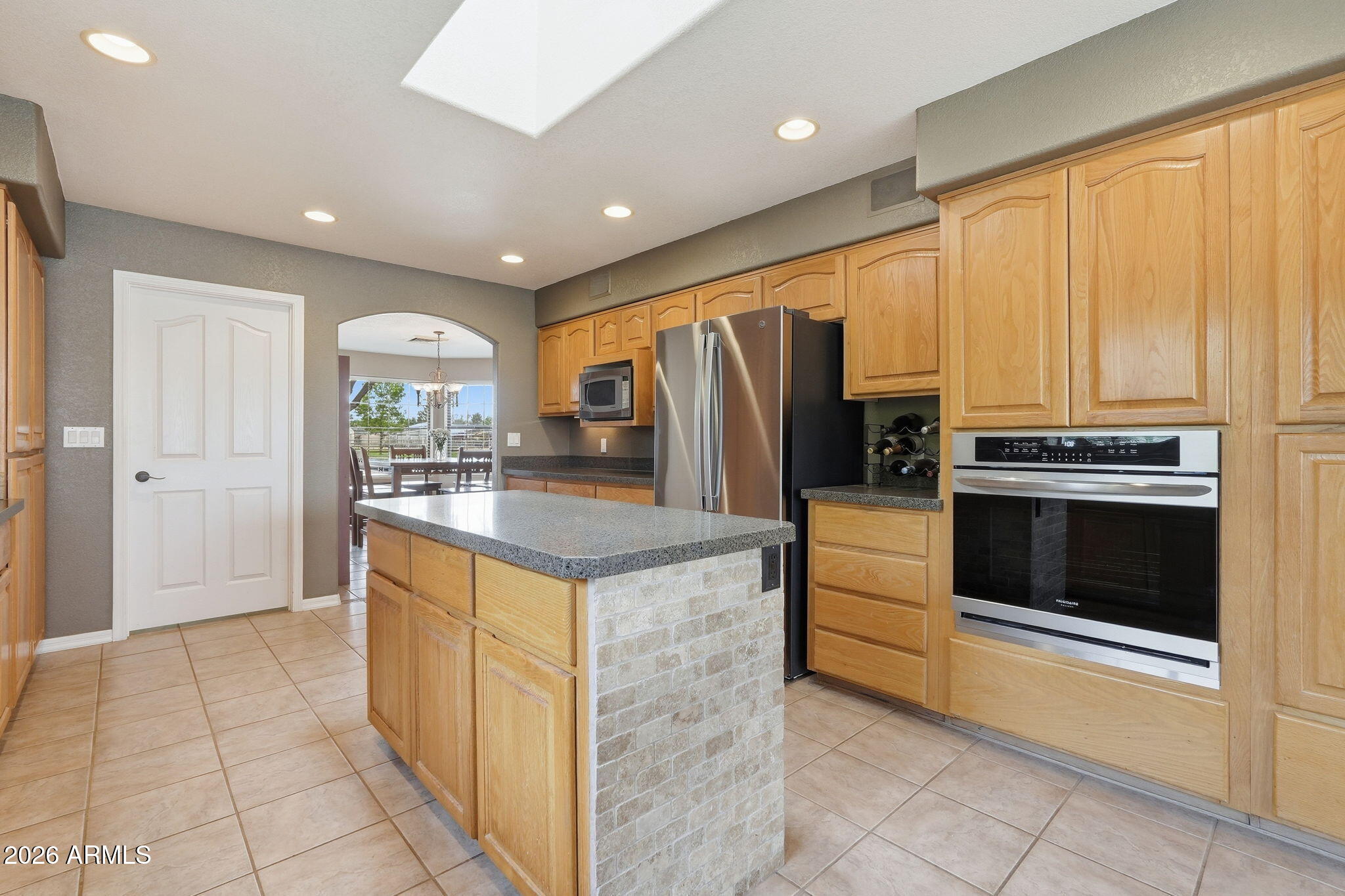 332 East Harrison Street Gilbert, AZ 85295 - Photo 31 of 101 a kitchen with stainless steel appliances granite countertop a refrigerator a stove and a sink