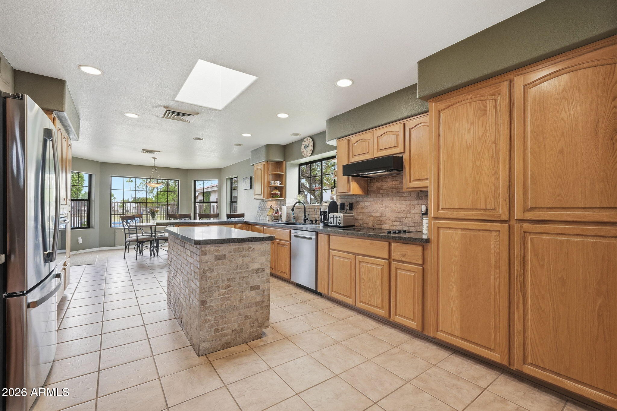 332 East Harrison Street Gilbert, AZ 85295 - Photo 32 of 101 a kitchen with counter top space cabinets and stainless steel appliances