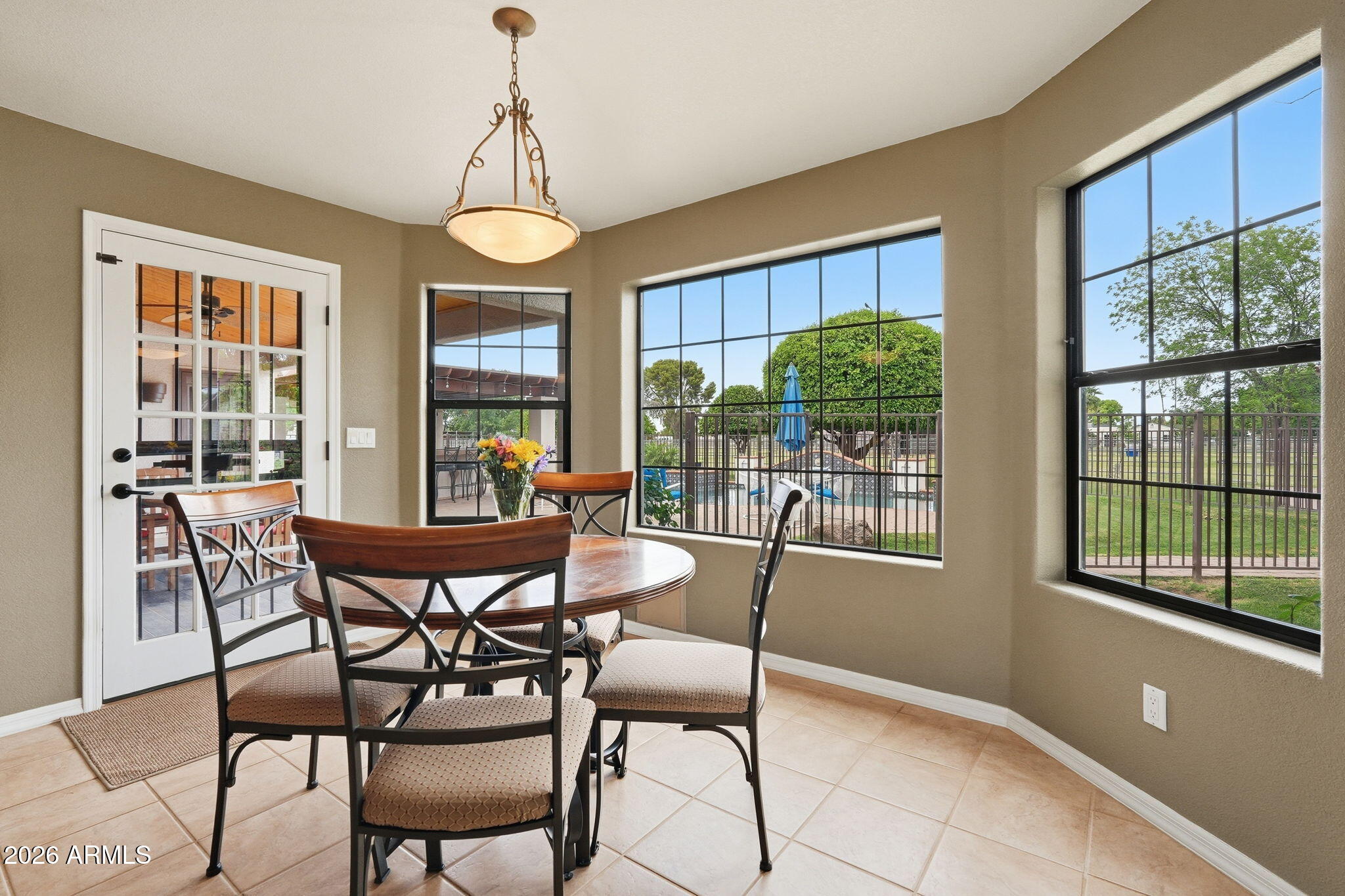 332 East Harrison Street Gilbert, AZ 85295 - Photo 38 of 101 a dining room with furniture a chandelier and wooden floor
