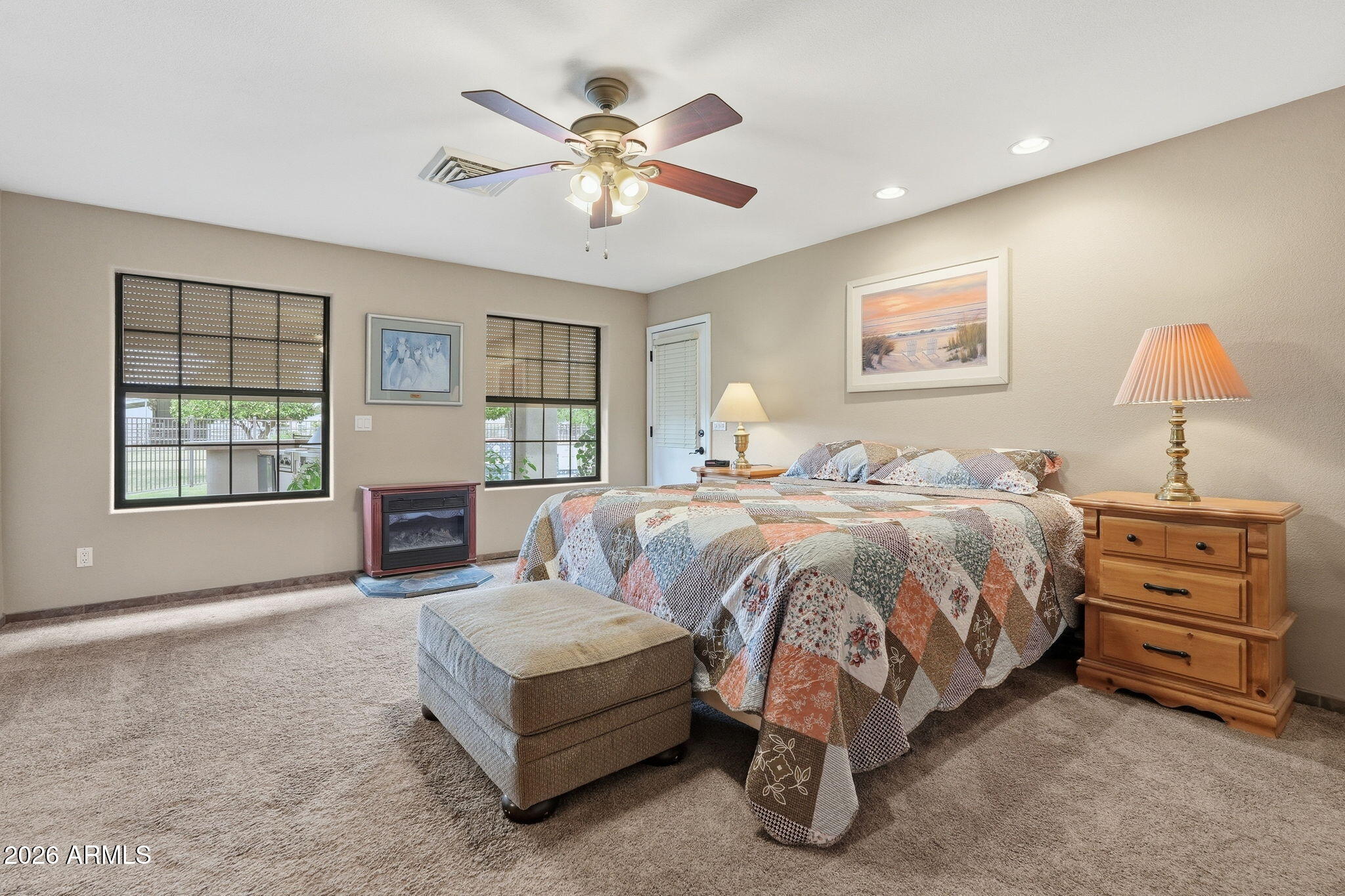332 East Harrison Street Gilbert, AZ 85295 - Photo 40 of 101 a spacious bedroom with a bed and a chandelier