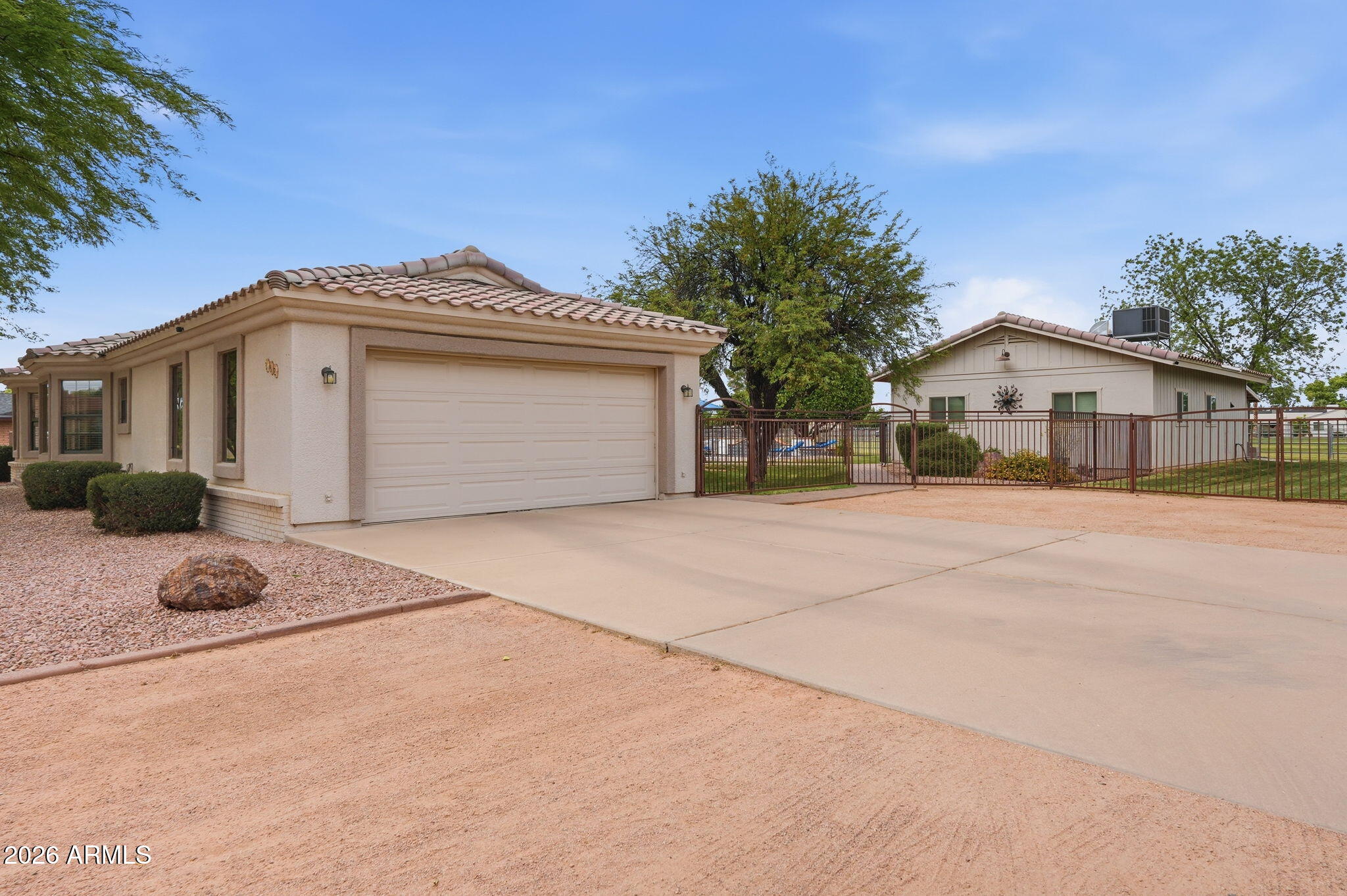 332 East Harrison Street Gilbert, AZ 85295 - Photo 3 of 101 a front view of a house with a yard and garage