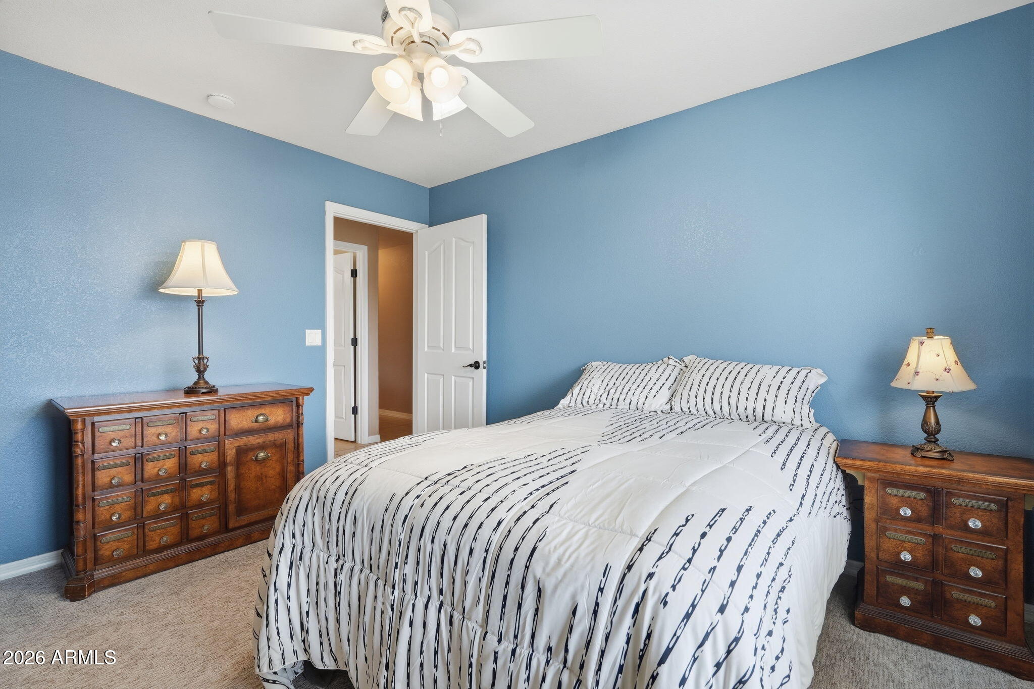 332 East Harrison Street Gilbert, AZ 85295 - Photo 49 of 101 a bedroom with a bed and a lamp on dresser