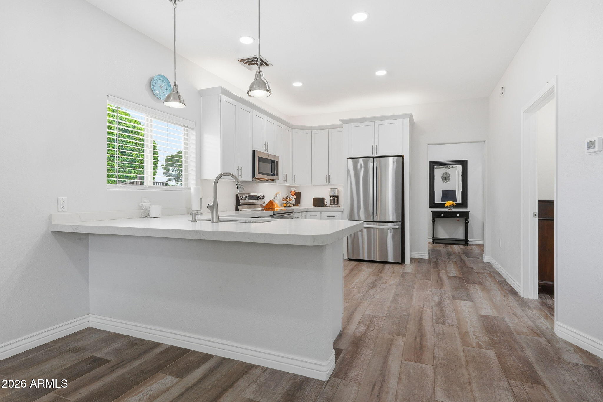 332 East Harrison Street Gilbert, AZ 85295 - Photo 55 of 101 a kitchen with stainless steel appliances a refrigerator sink and microwave