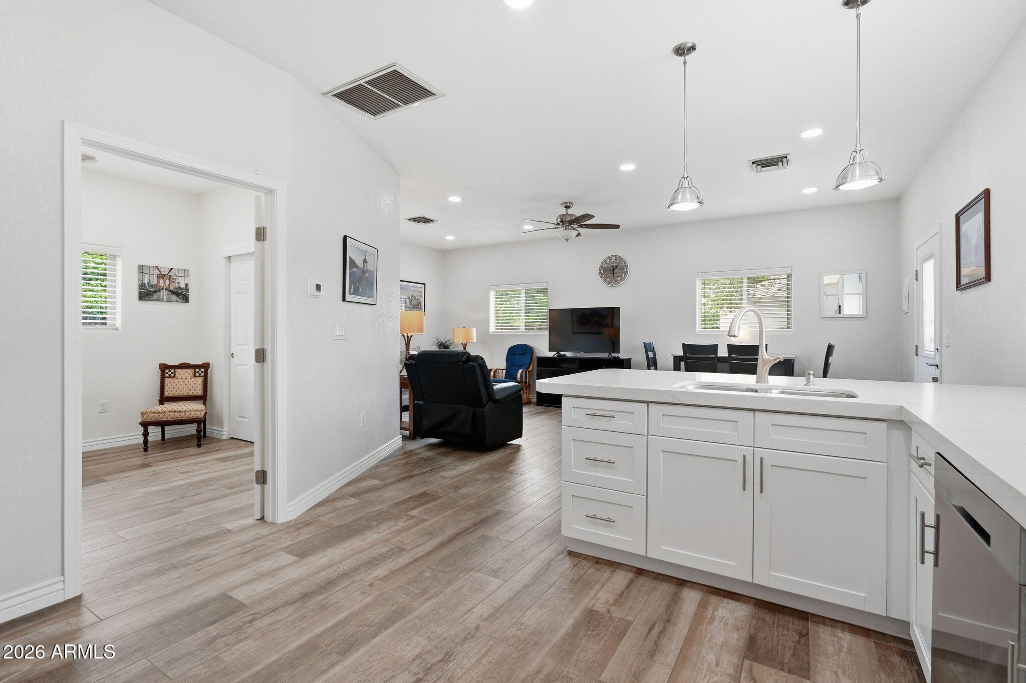 332 East Harrison Street Gilbert, AZ 85295 - Photo 63 of 101 a large white kitchen with a refrigerator a stove and a sink