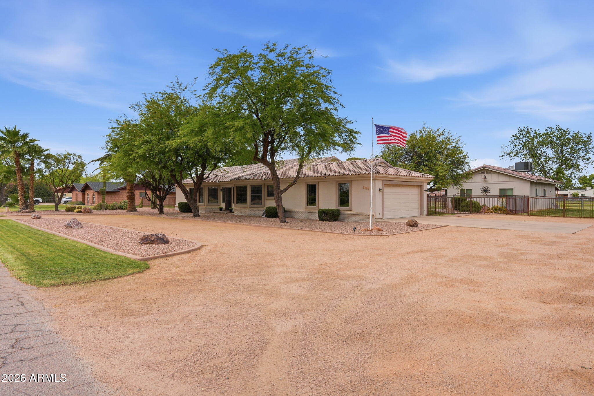 332 East Harrison Street Gilbert, AZ 85295 - Photo 4 of 101 a front view of a house with a yard and a garage