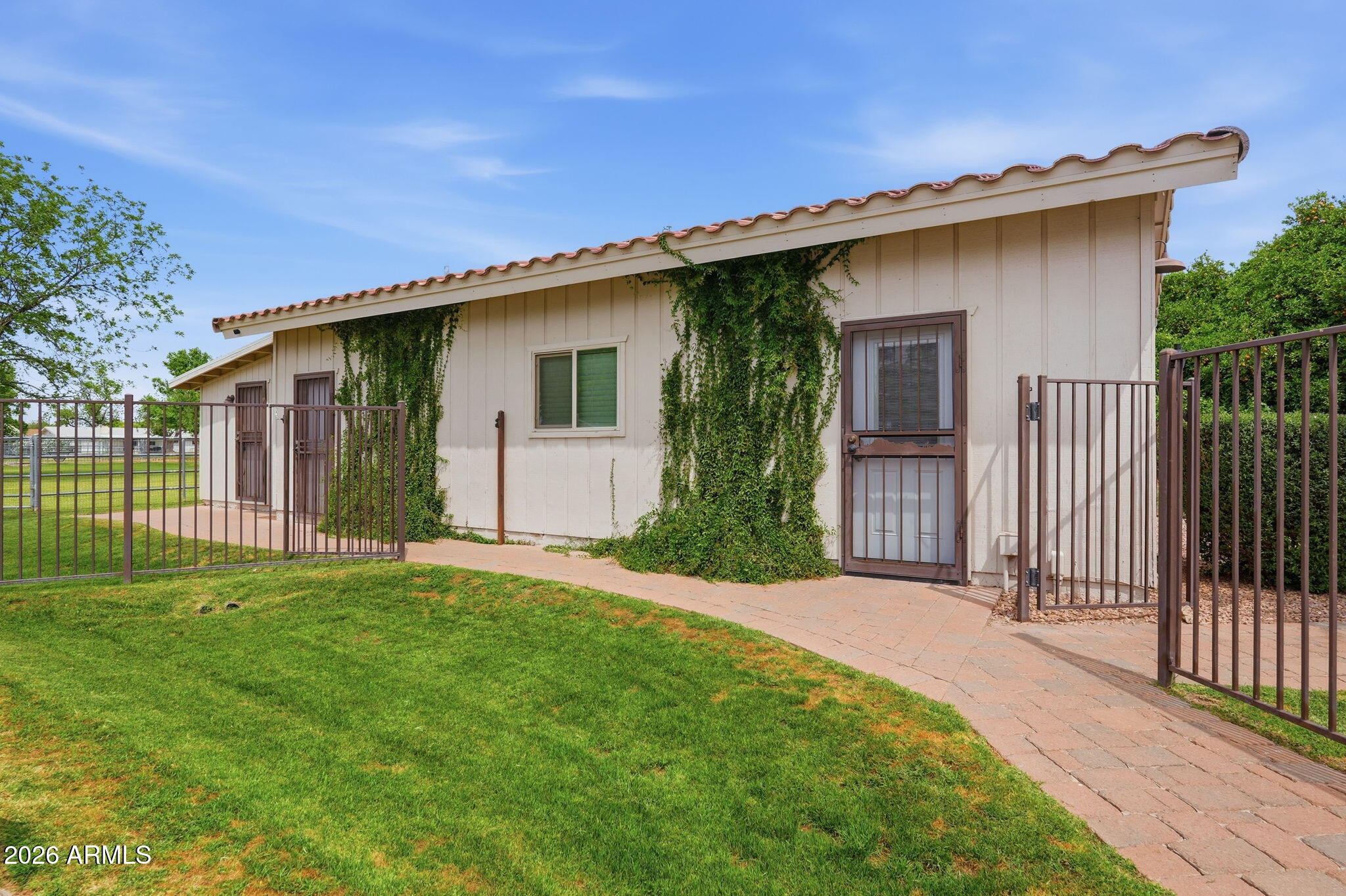 332 East Harrison Street Gilbert, AZ 85295 - Photo 71 of 101 a front view of a house with a yard and garage