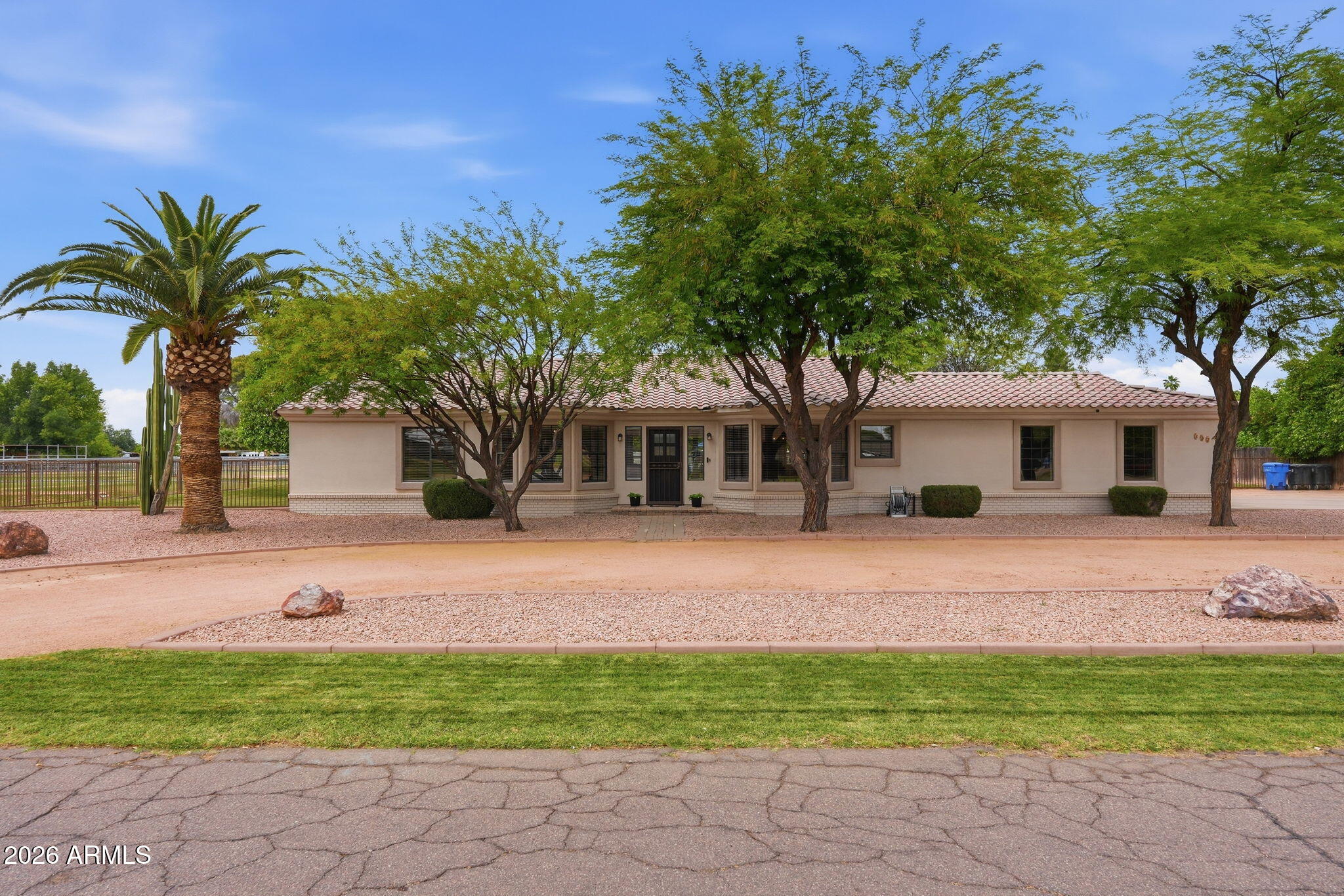 332 East Harrison Street Gilbert, AZ 85295 - Photo 93 of 101 a front view of a house with a garden