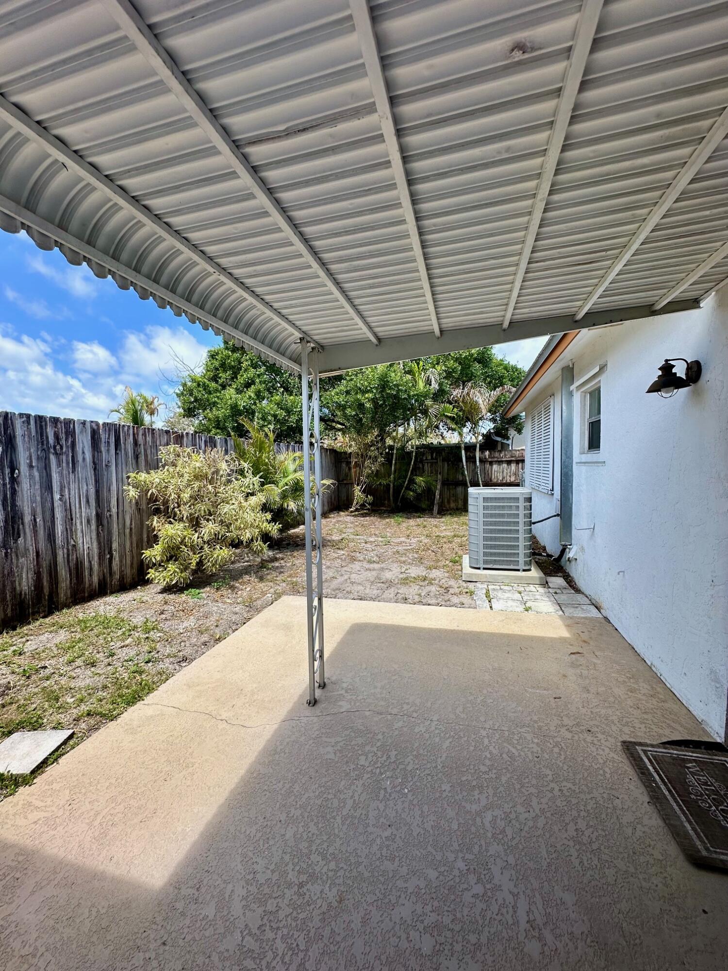 8698 Southeast Hobe Ridge Avenue Hobe Sound, FL 33455 - Photo 13 of 16 Covered porch