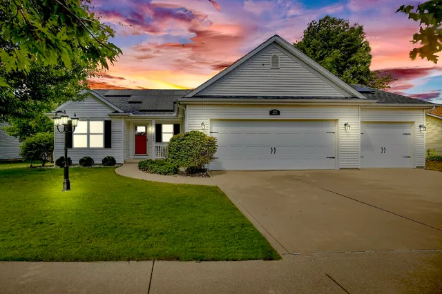a front view of a house with a yard