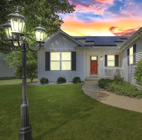 a view of a house with a yard