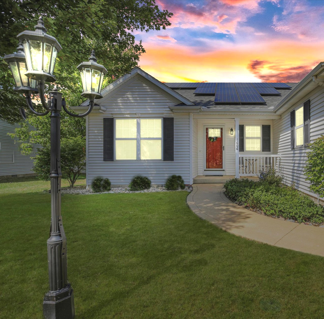 1606 East Marc Trail Urbana, IL 61802 - Photo 3 of 160 a front view of a house with a yard