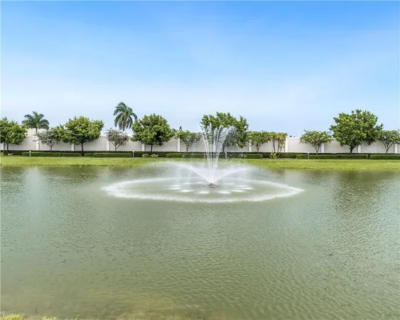 a view of a lake with houses in the back