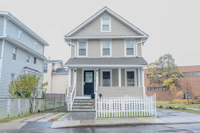a front view of a house with a yard