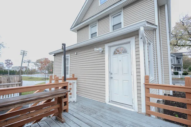 a view of a deck with wooden floor and seating space