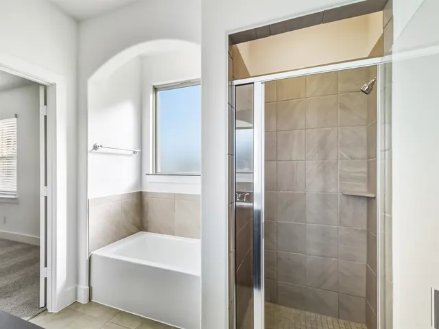 a bathroom with a shower and a sink