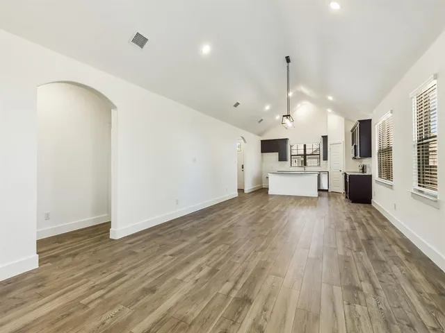 a view of kitchen with furniture and wooden floor