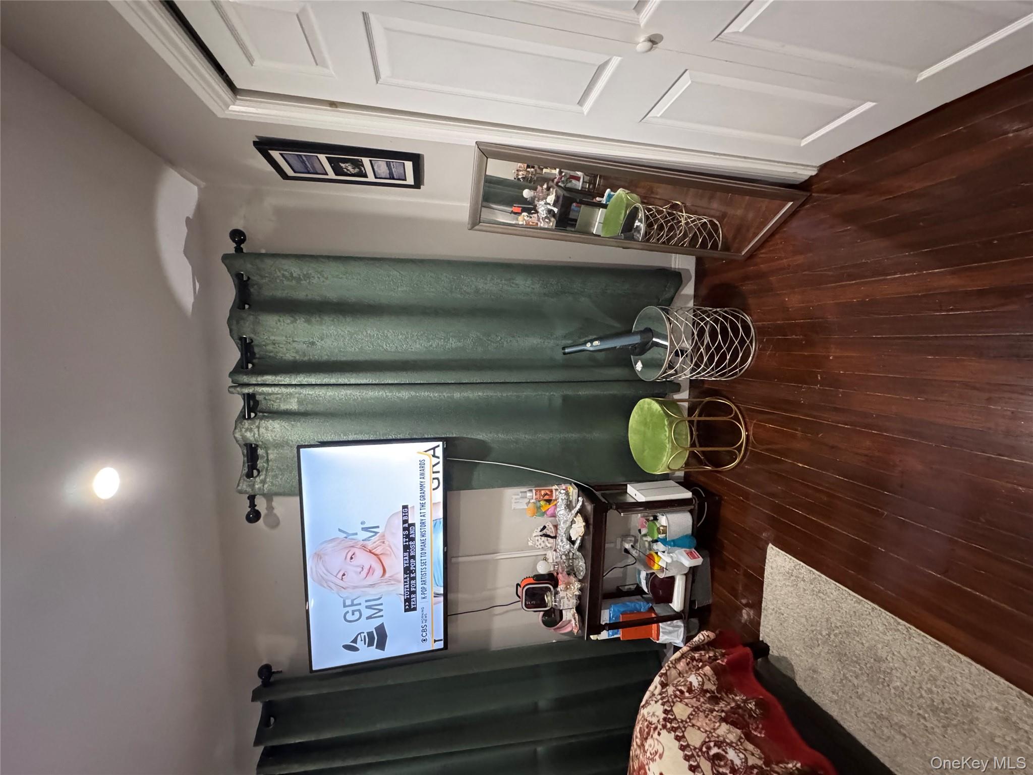 19 Hamilton Road Hempstead, NY 11550 - Photo 12 of 14 a living room with furniture and a wooden floor