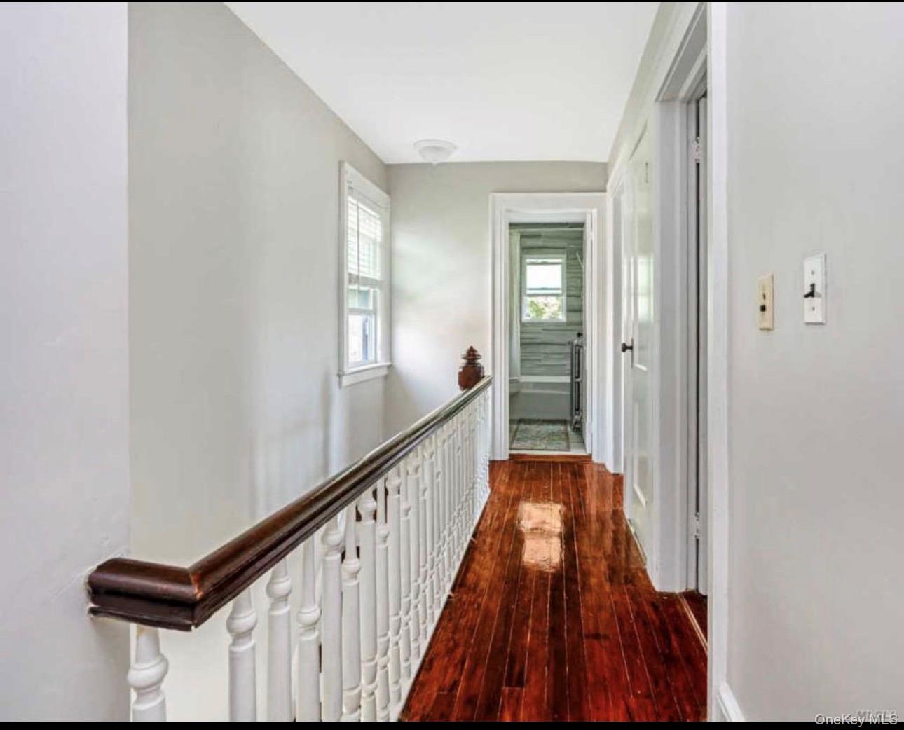 19 Hamilton Road Hempstead, NY 11550 - Photo 3 of 14 a view of a hallway view with wooden floor and staircase