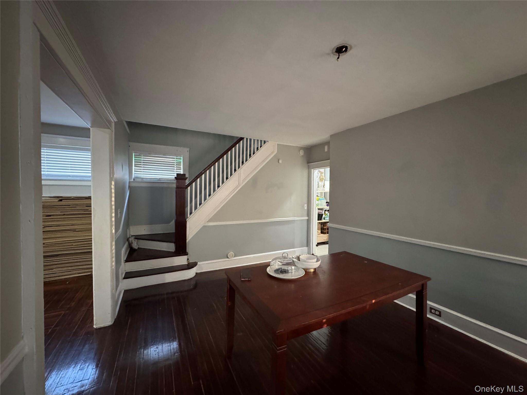 19 Hamilton Road Hempstead, NY 11550 - Photo 6 of 14 a view of entryway and hall with wooden floor