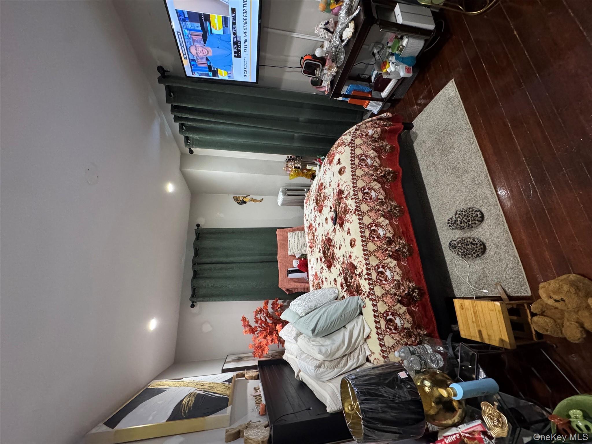 19 Hamilton Road Hempstead, NY 11550 - Photo 10 of 14 a bed sitting in a room next to a window