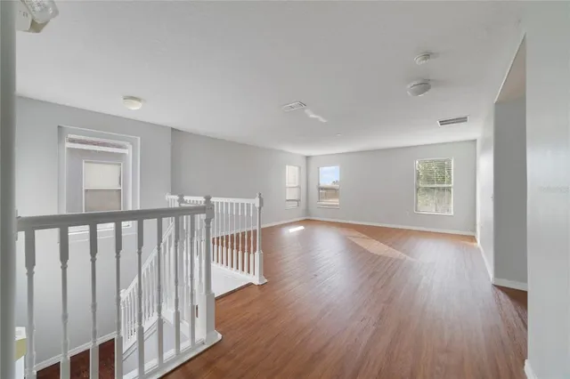 a view of entryway with wooden floor