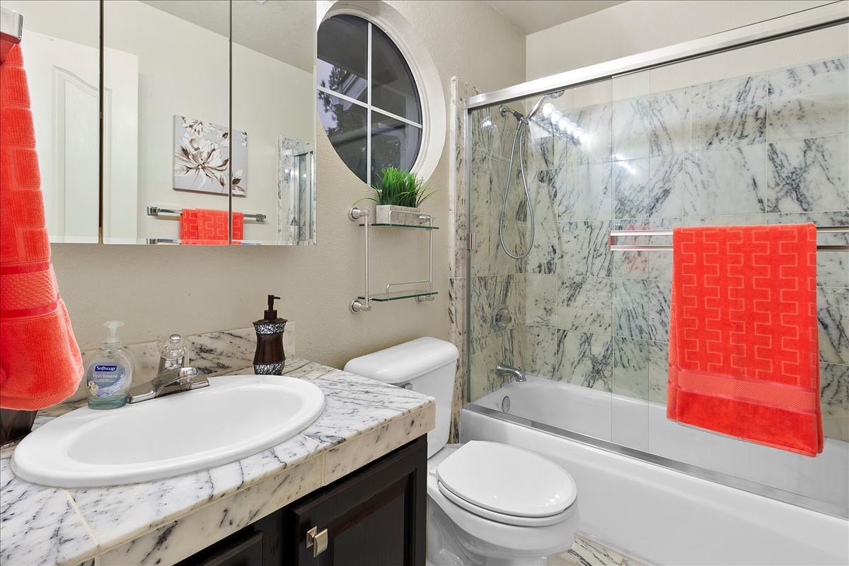 136 Redding Road Campbell, CA 95008 - Photo 28 of 30 a bathroom with a granite countertop sink and a mirror