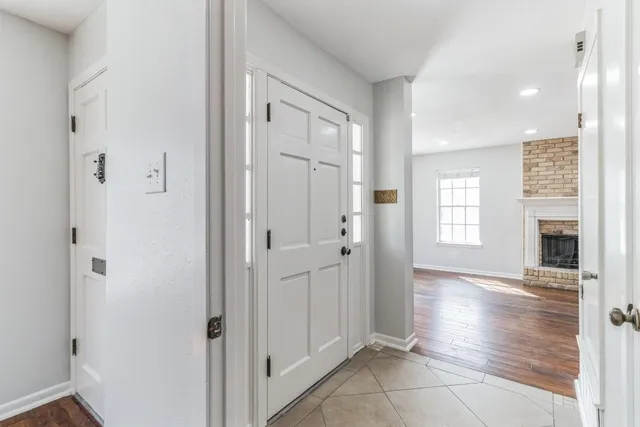 a kitchen with a refrigerator sink and cabinets