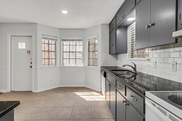 a kitchen with stainless steel appliances a refrigerator and a sink