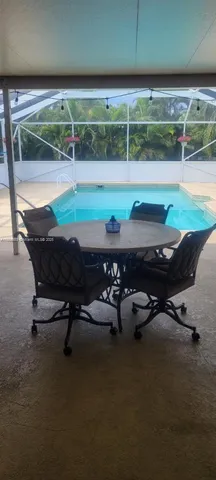 a view of a swimming pool with a lounge chair