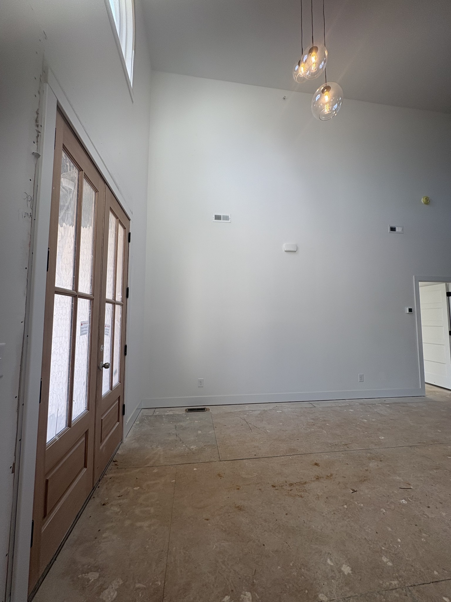 370 Young Lane Pleasant View, TN 37146 - Photo 3 of 27 wooden floor in an empty room with a window